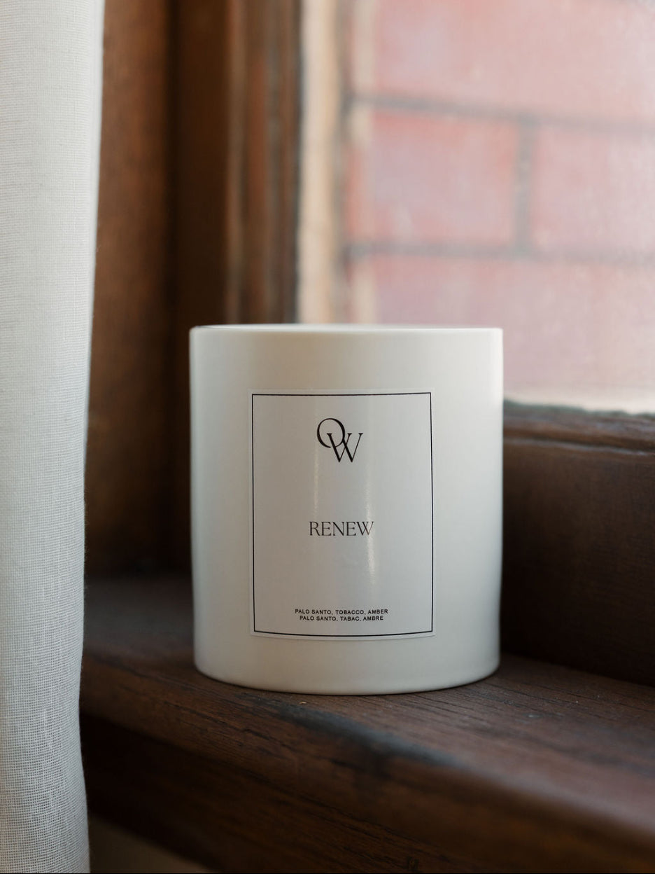 One Wednesday Renew soy candle in a white vessel.