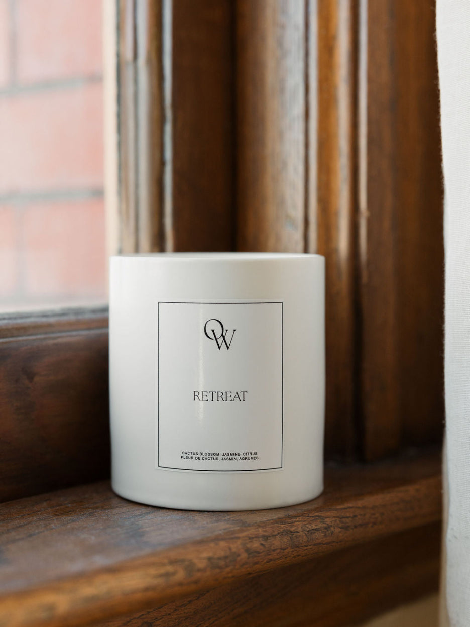 One Wednesday Retreat soy candle in a white vessel.